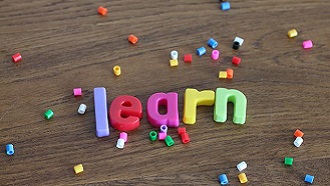 Learn spelled out in multicolor plastic letters