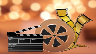 Movie projector reel and clapperboard