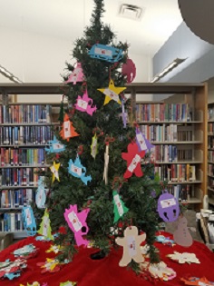 Christmas tree decorated with multicolored paper ornaments